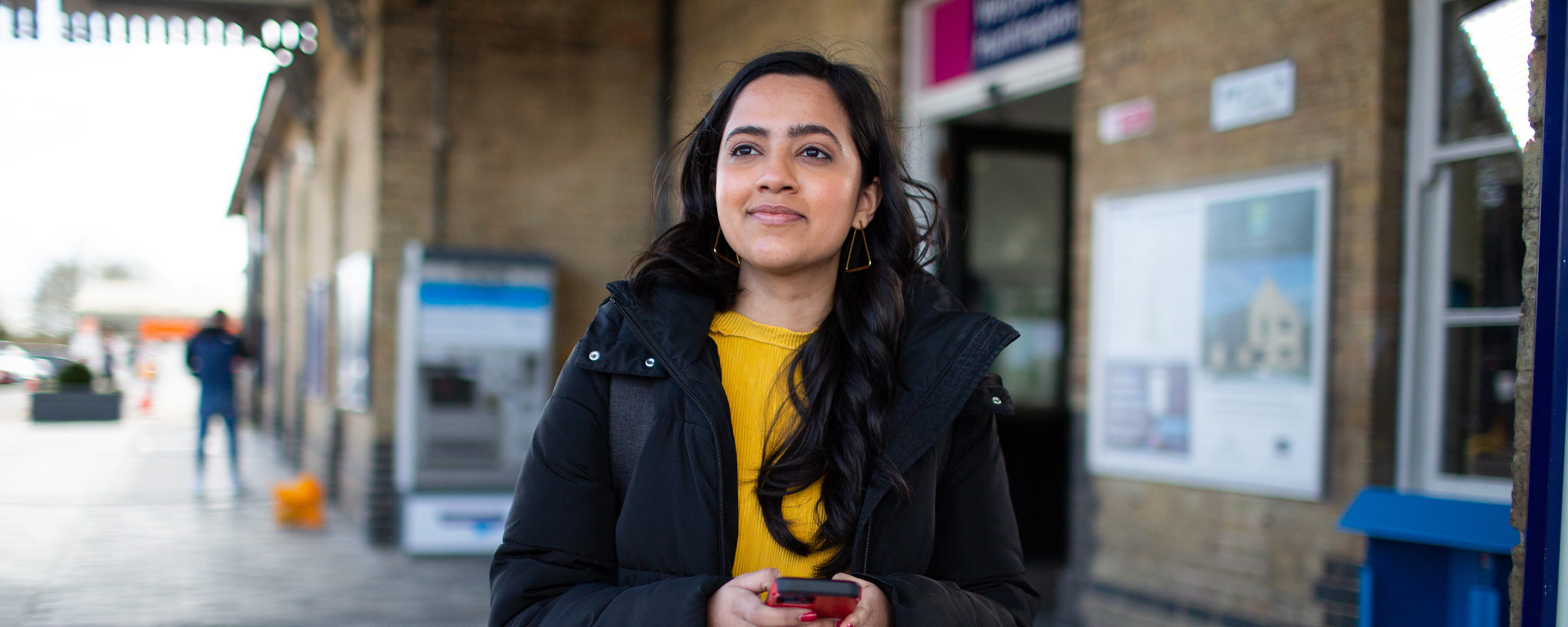 A woman at a railway station