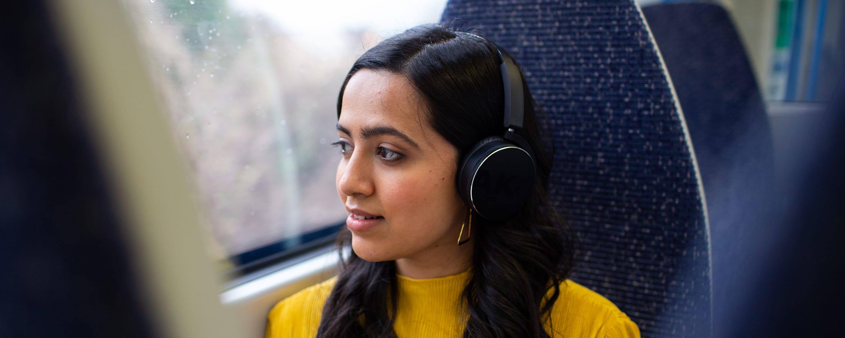A woman sitting in a train