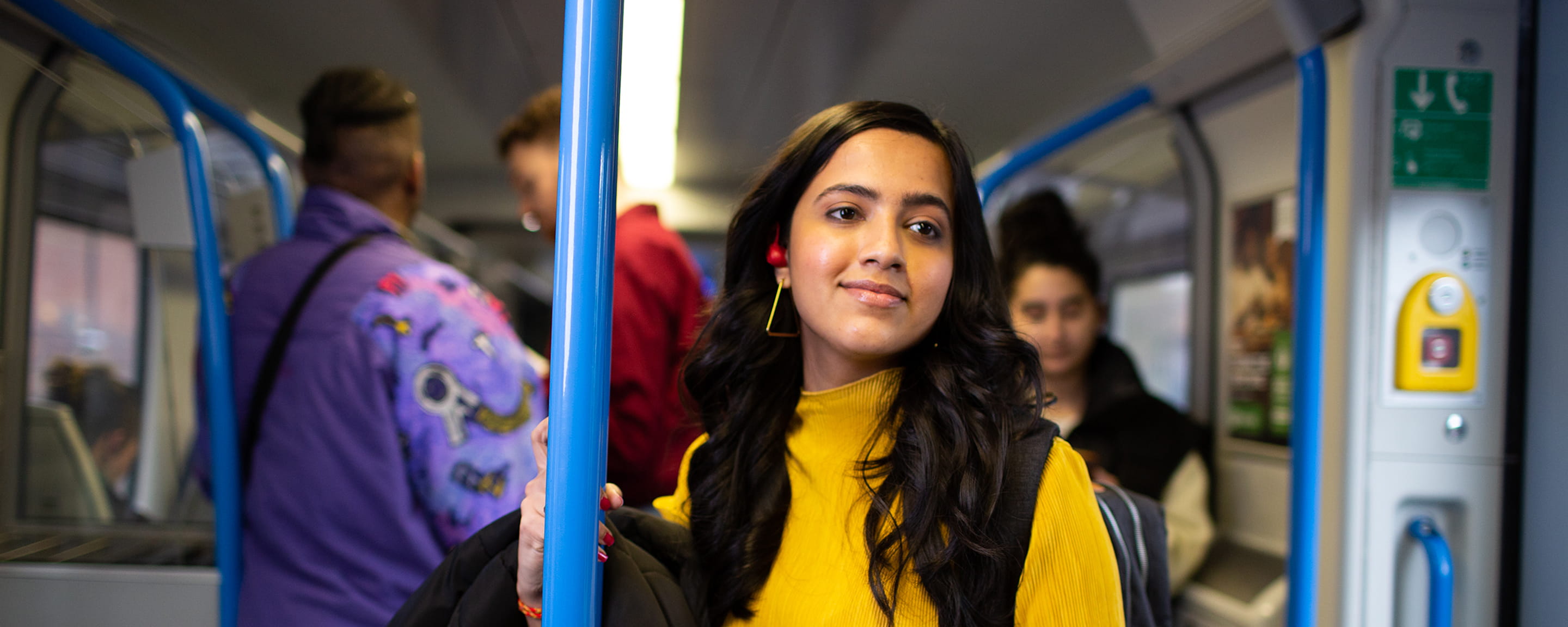A woman standing in a train