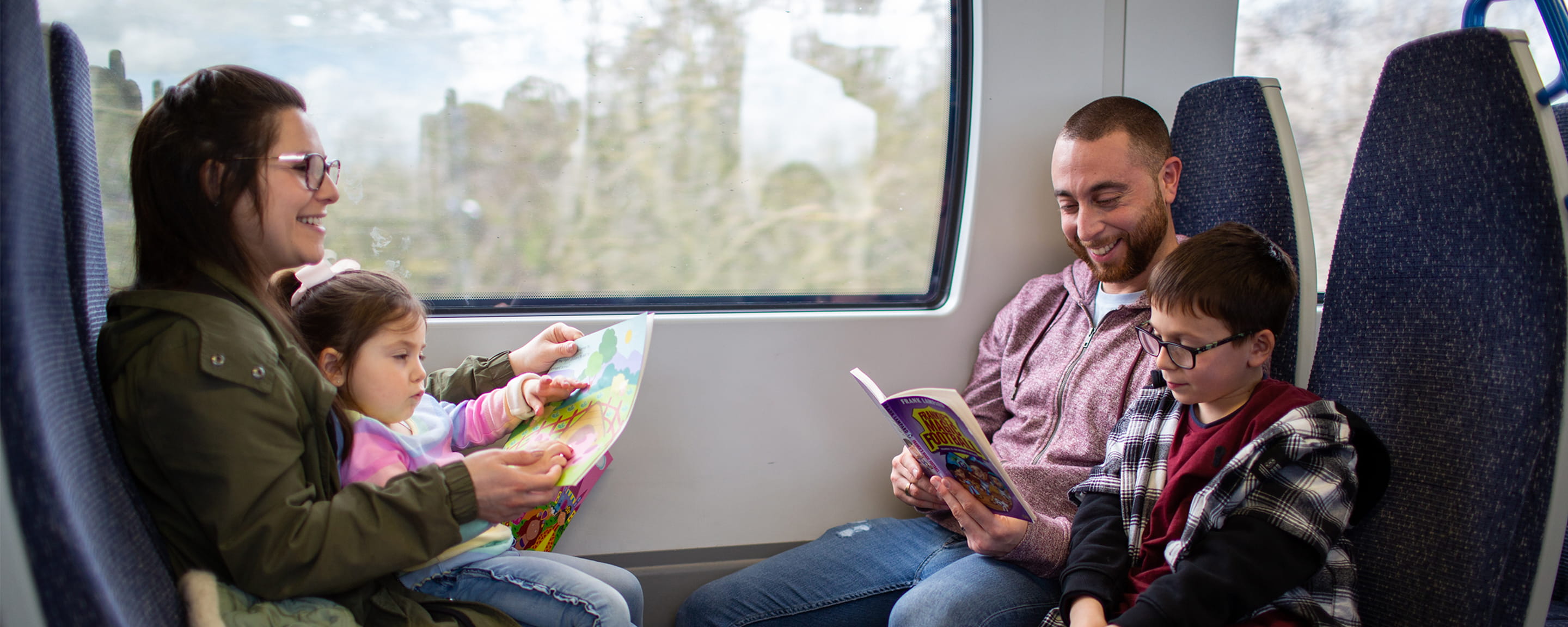 A family sitting in a train