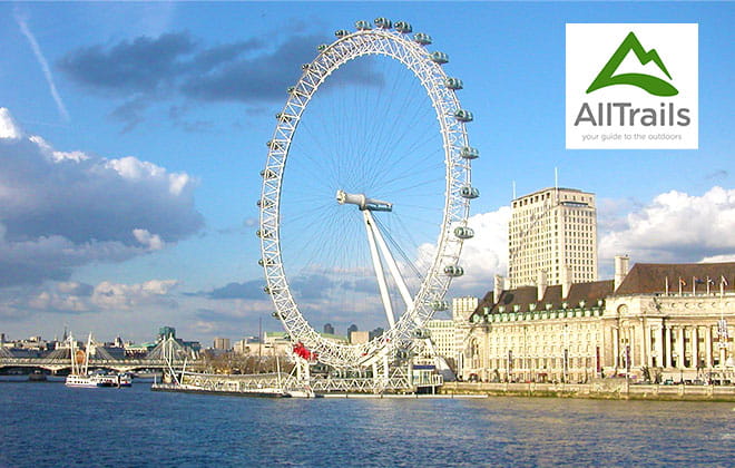 a large ship in the water with London Eye in the background