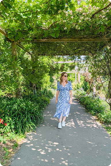 A girl walking in gardens