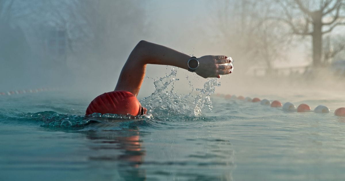 Person swimming in an outdoor lido