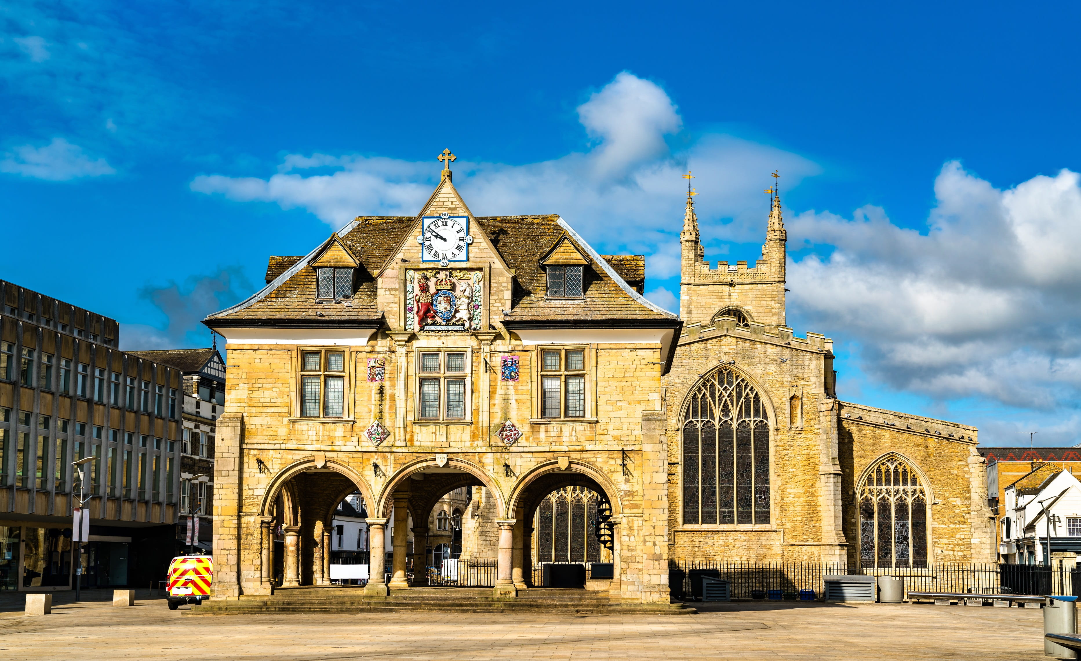 a large clock tower in front of a building