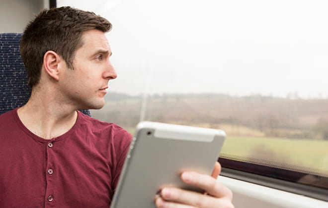 a man holding a laptop