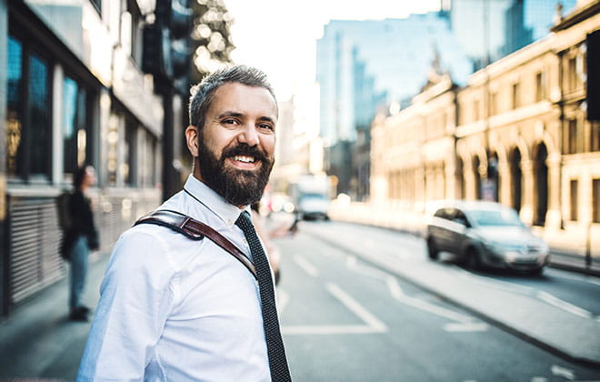 a man standing on a city street