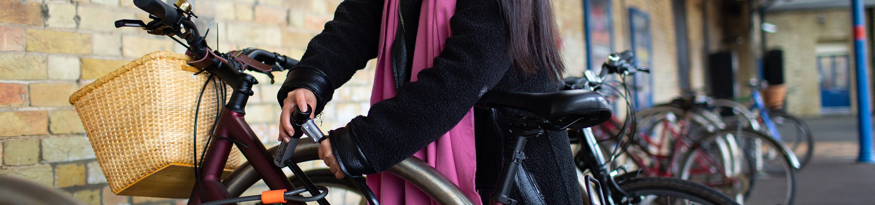 A woman standing by a bike