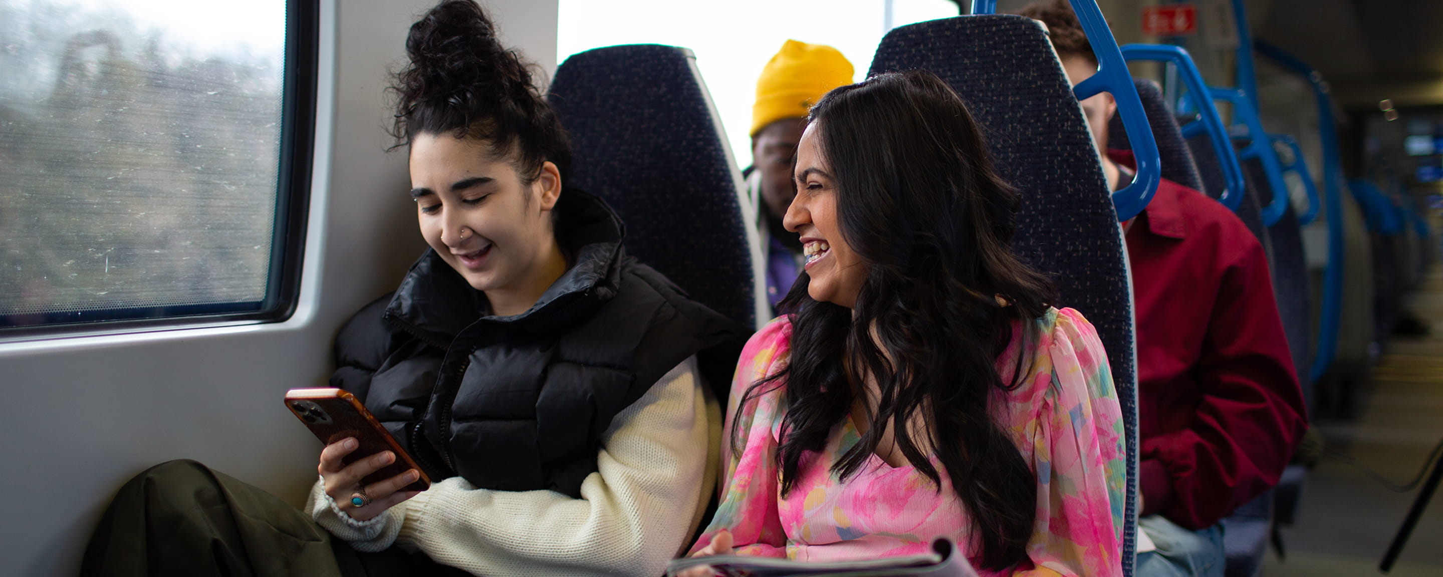 Two women sitting in a train carriage