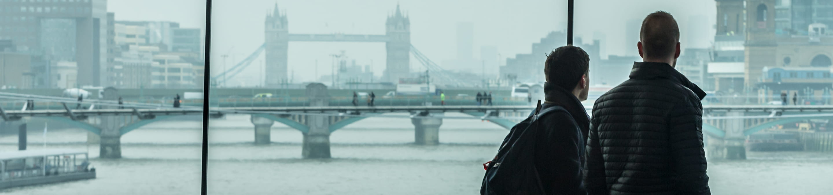 a man standing on a bridge