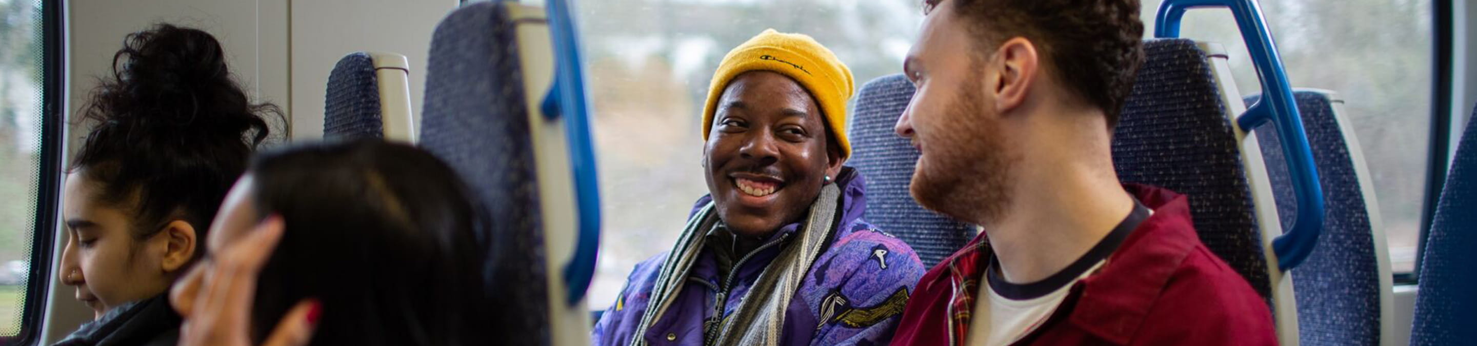 Two people in a train carriage