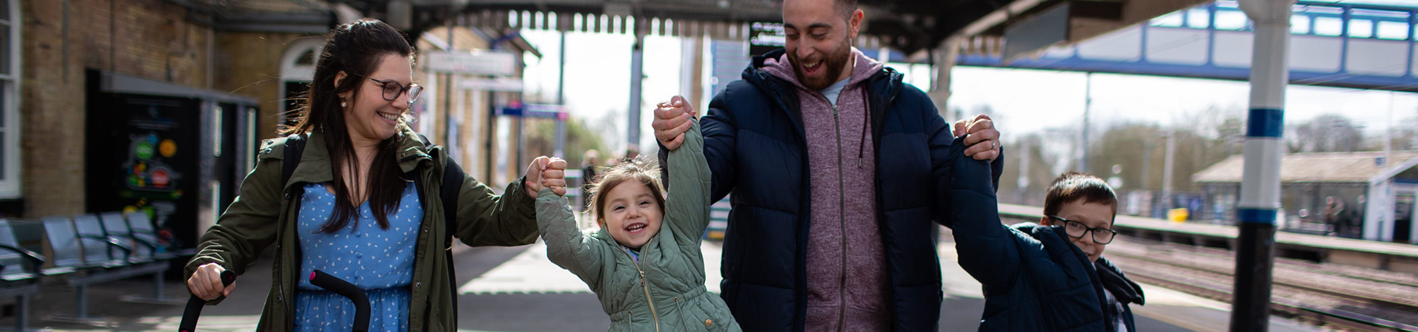 A family on a train platform