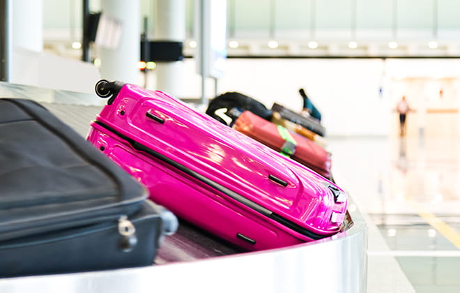 a pile of luggage sitting on top of a suitcase