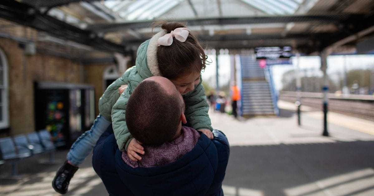 family on thameslink platform getting train to greenhithe for bluewater
