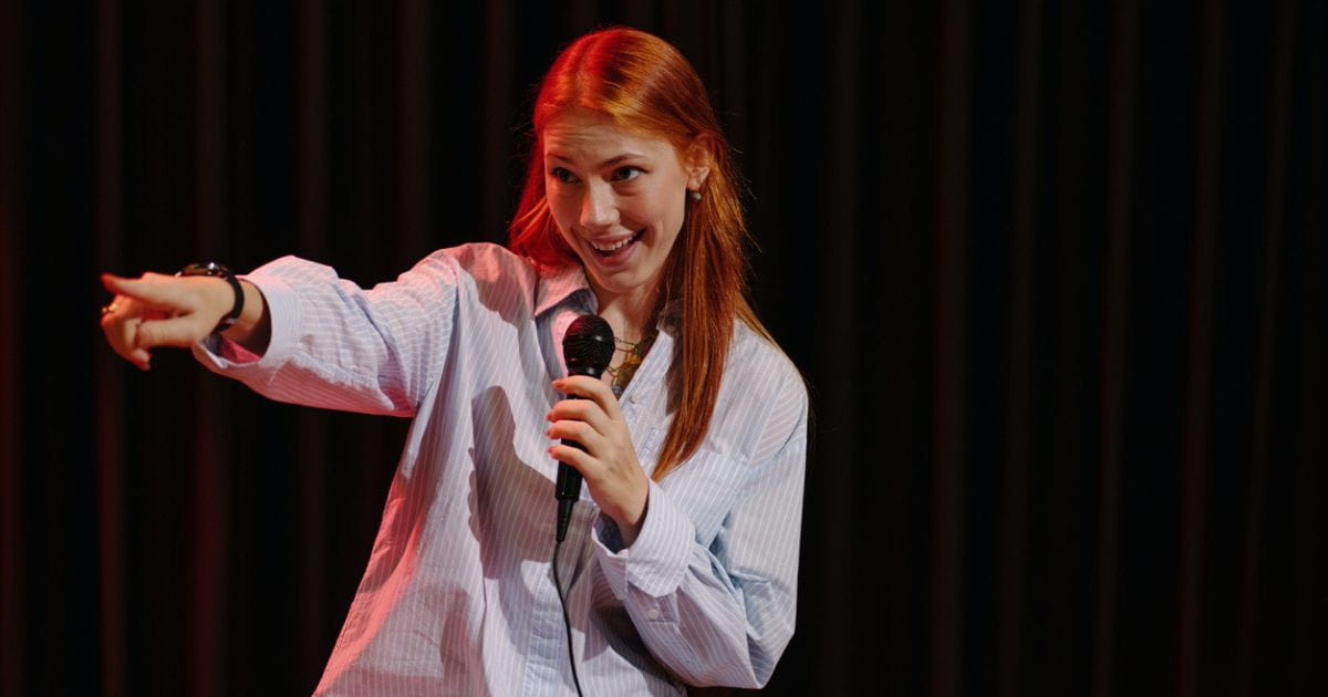 Image of a woman performing stand up comedy