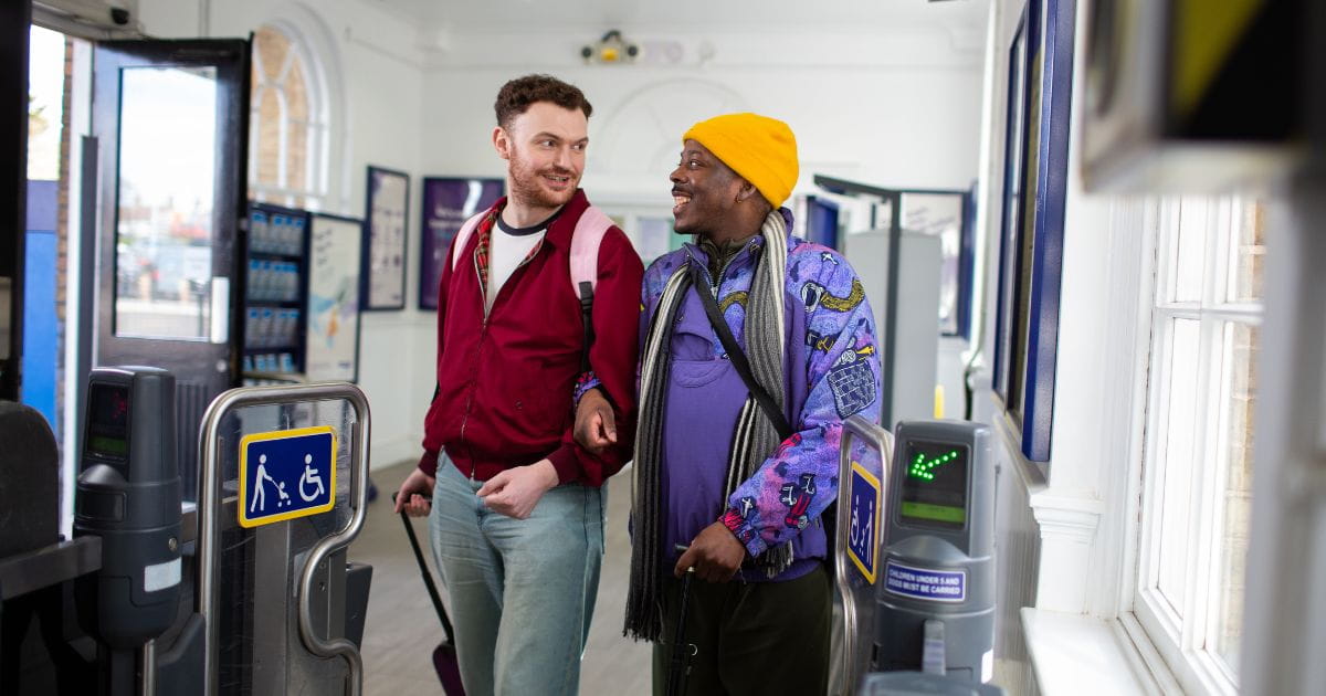 A couple travelling by train to the airport
