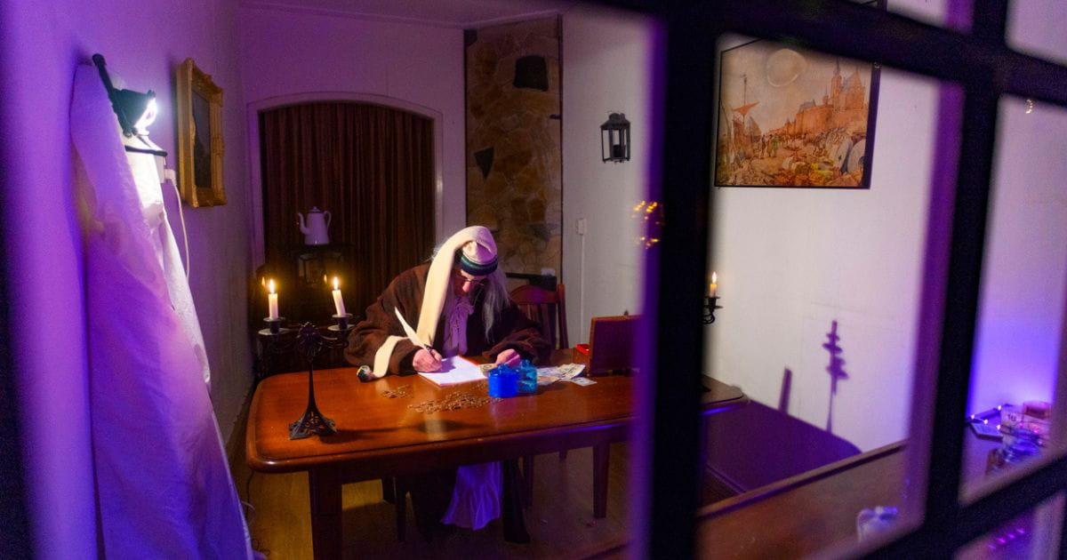 Scrooge at his desk for A Christmas Carol