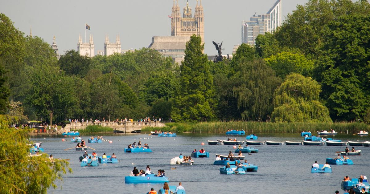 Hyde Park on a summer day Serpentine lake families pedal boats