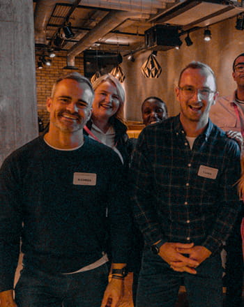 A woman talking to a barman