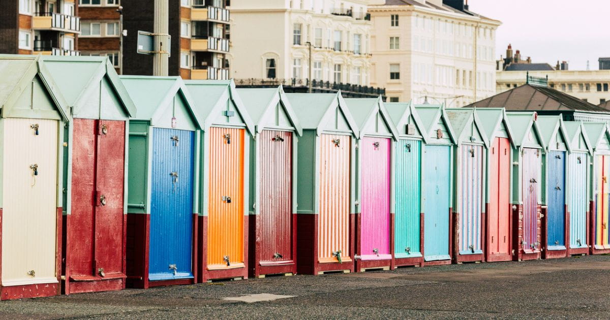 Colourful beach huts on Brighton promenade seafront